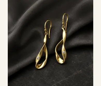 Maison Vela Ribbon Drop Earrings in polished gold
